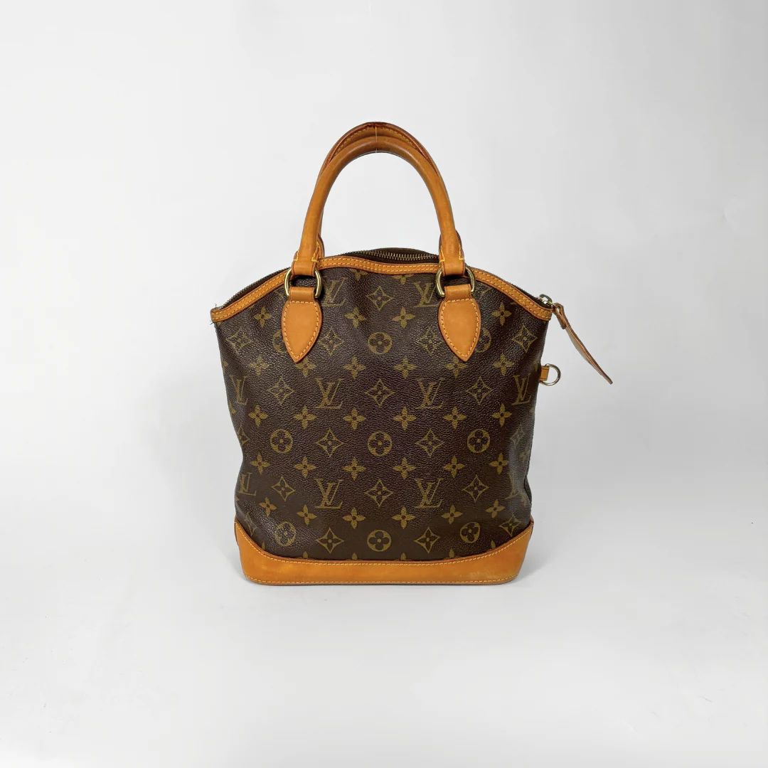 Brown handbag with monogram pattern on a white background