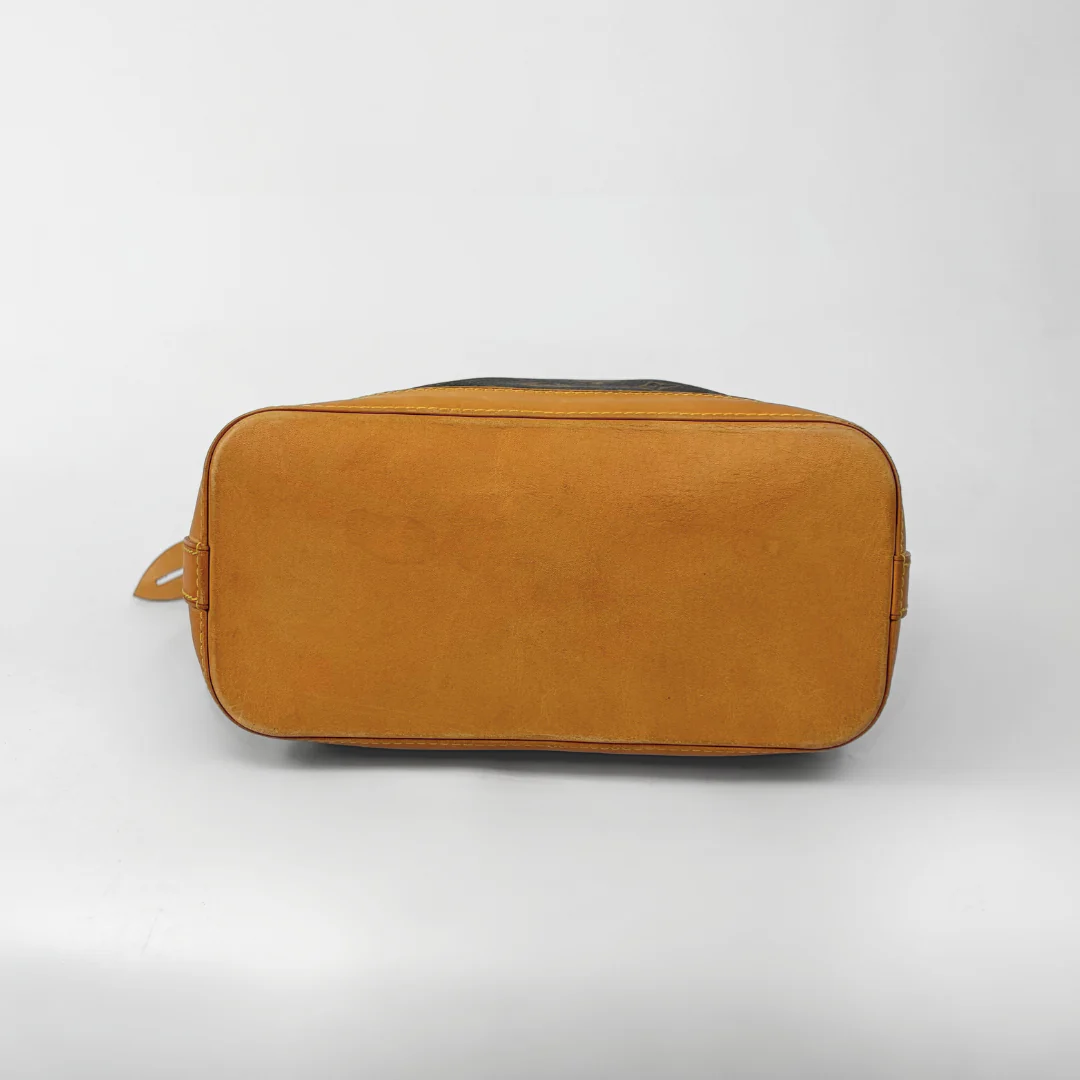 Brown duffel bag with monogram pattern on a white background
