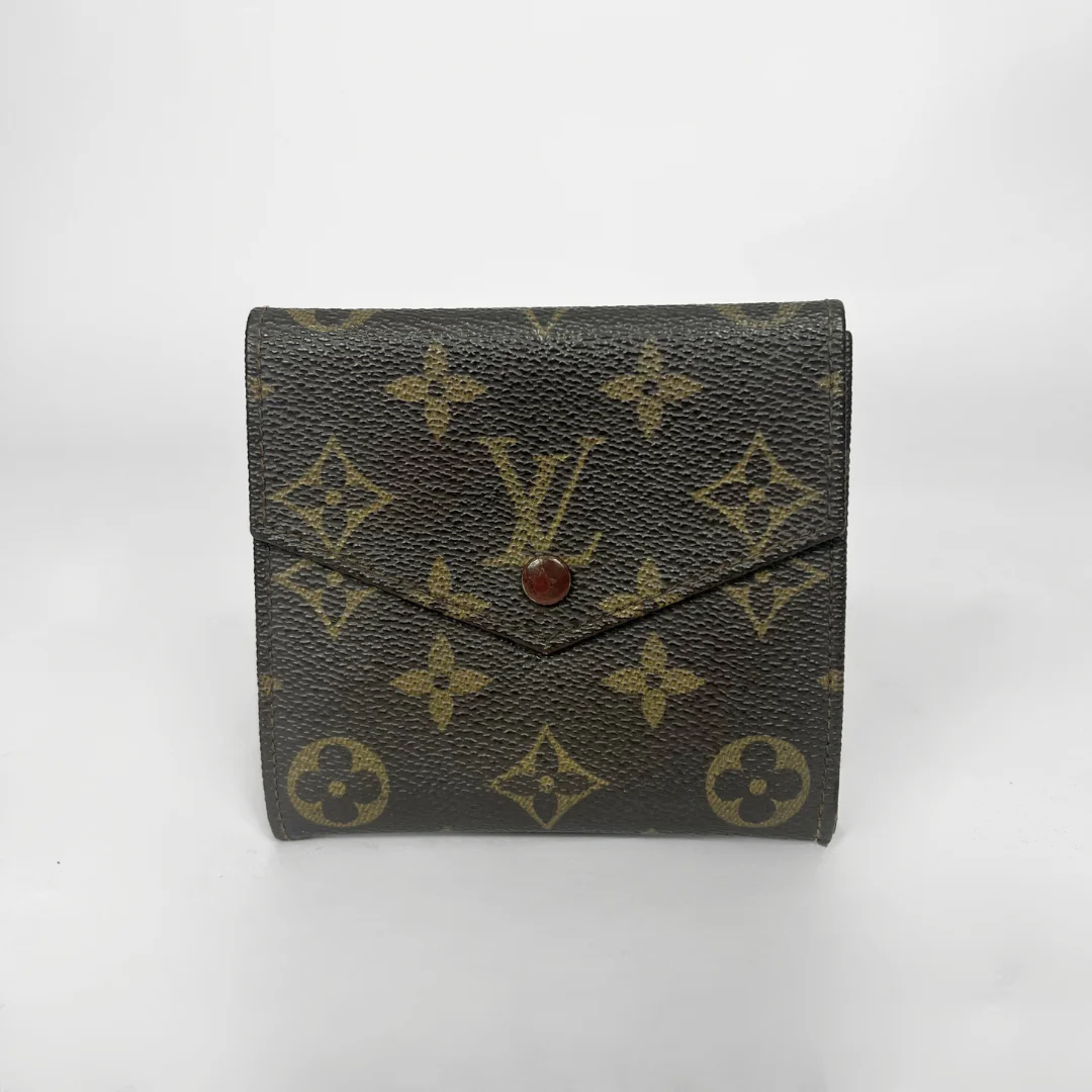 Louis Vuitton wallet with monogram pattern on a white background