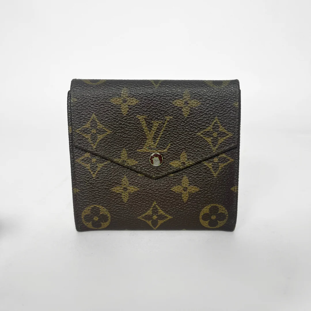 Louis Vuitton wallet with monogram pattern on a white background