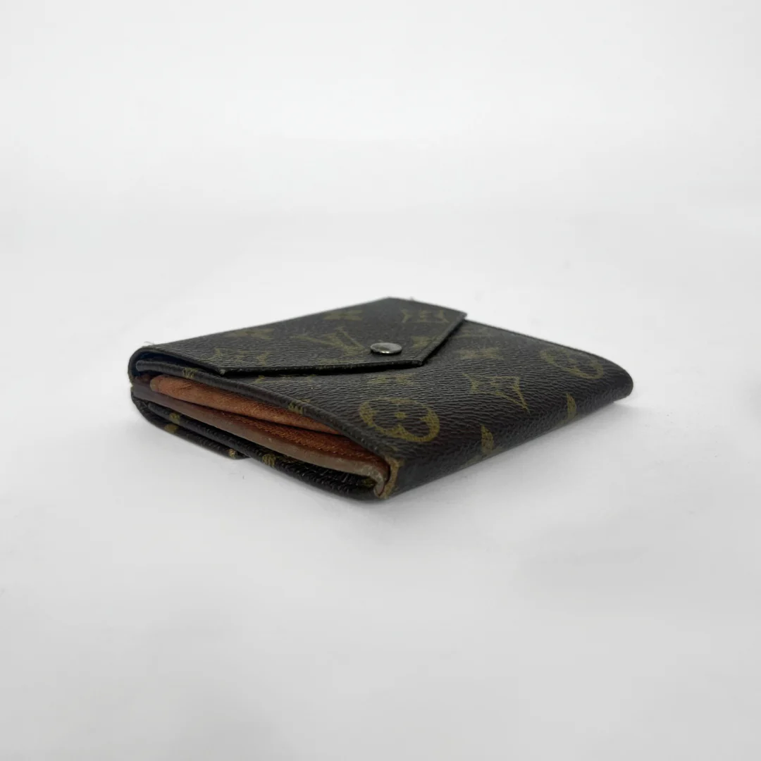 Louis Vuitton wallet on a white background