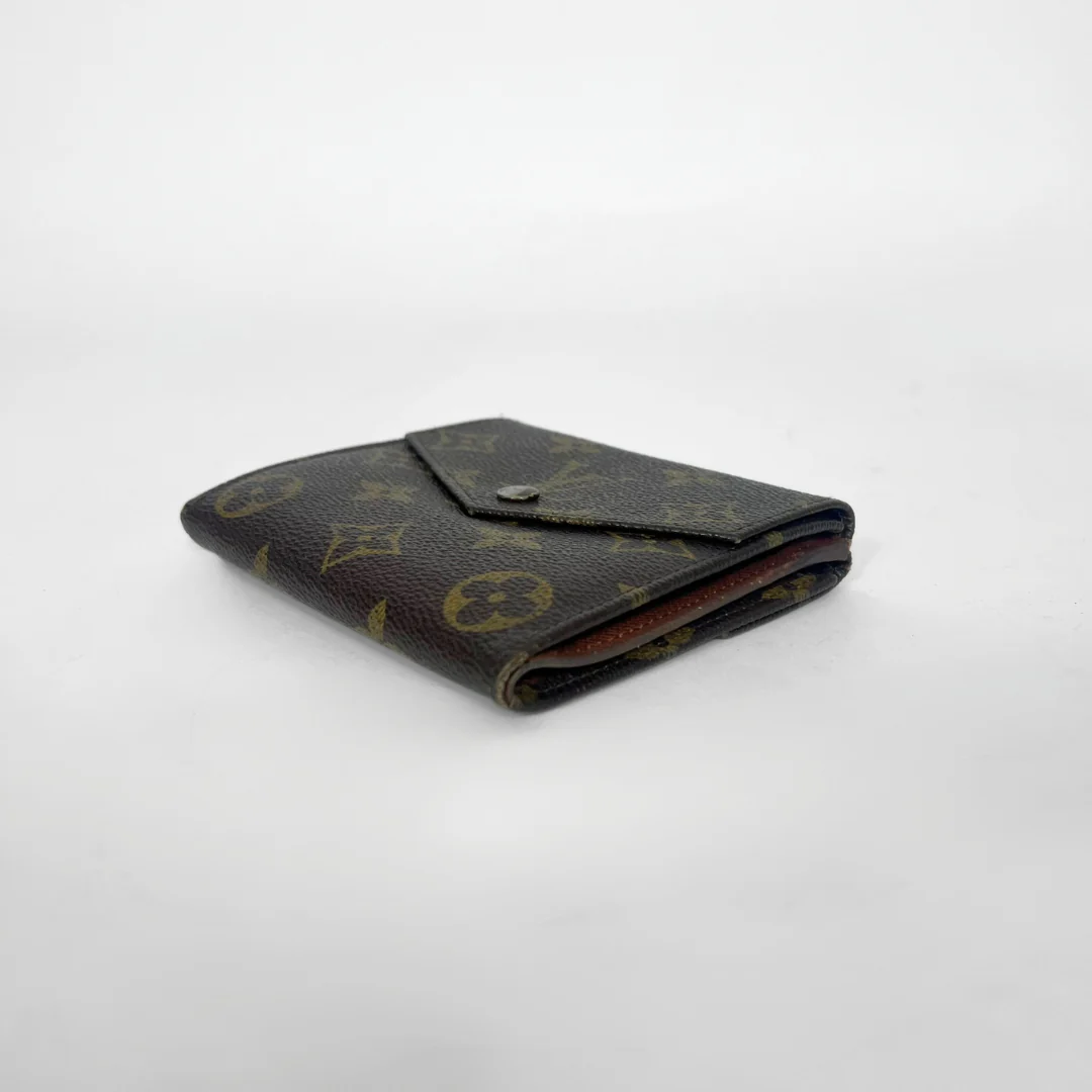 Vintage wallet with monogram pattern on a white background