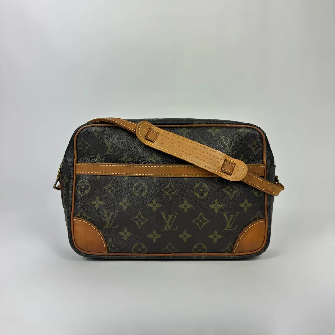 Brown handbag with gold monogram pattern 