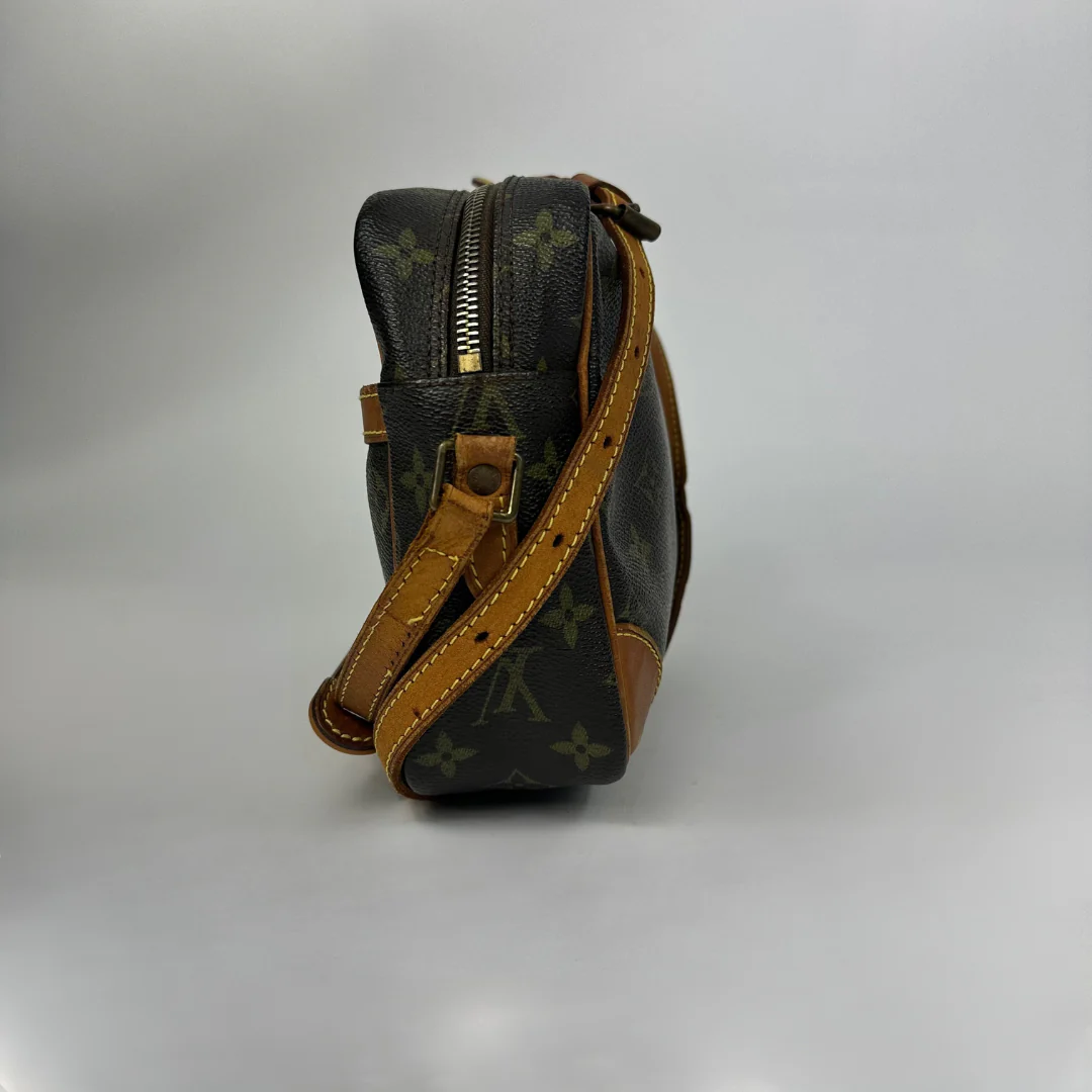 Brown handbag with gold monogram pattern 