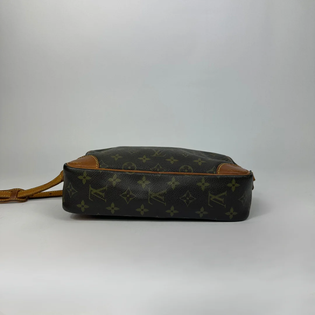 Brown handbag with gold monogram pattern 