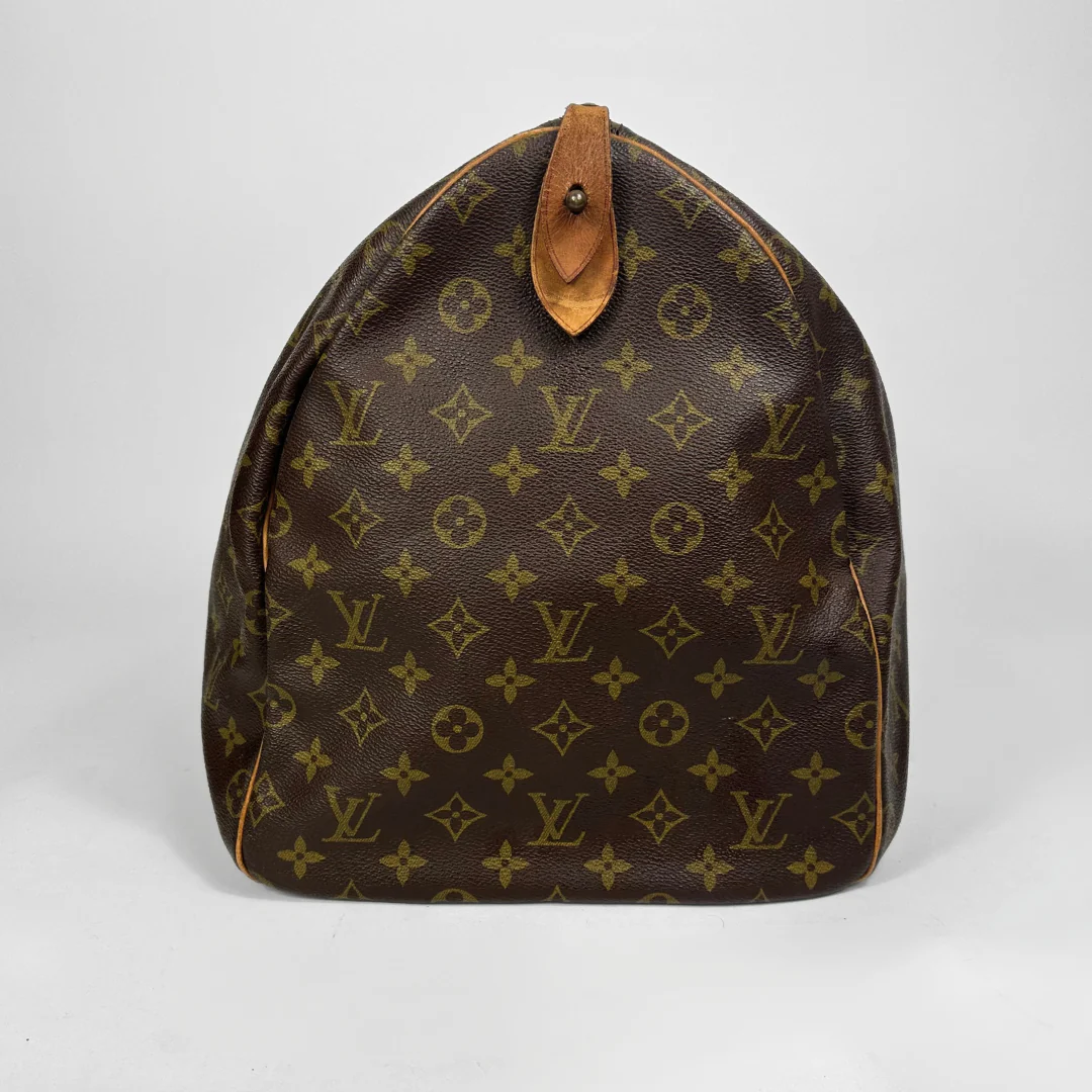 Brown Louis Vuitton bag with monogram pattern on a white background