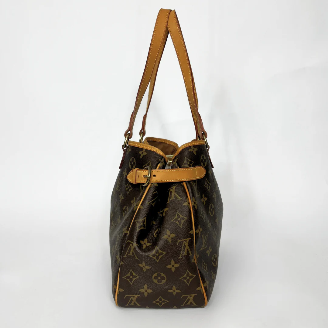 Designer handbag with monogram pattern on a white background