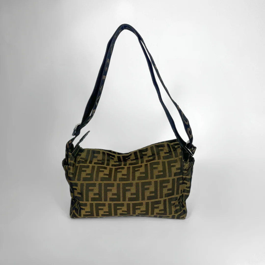 Designer handbag with a distinctive pattern on a white background