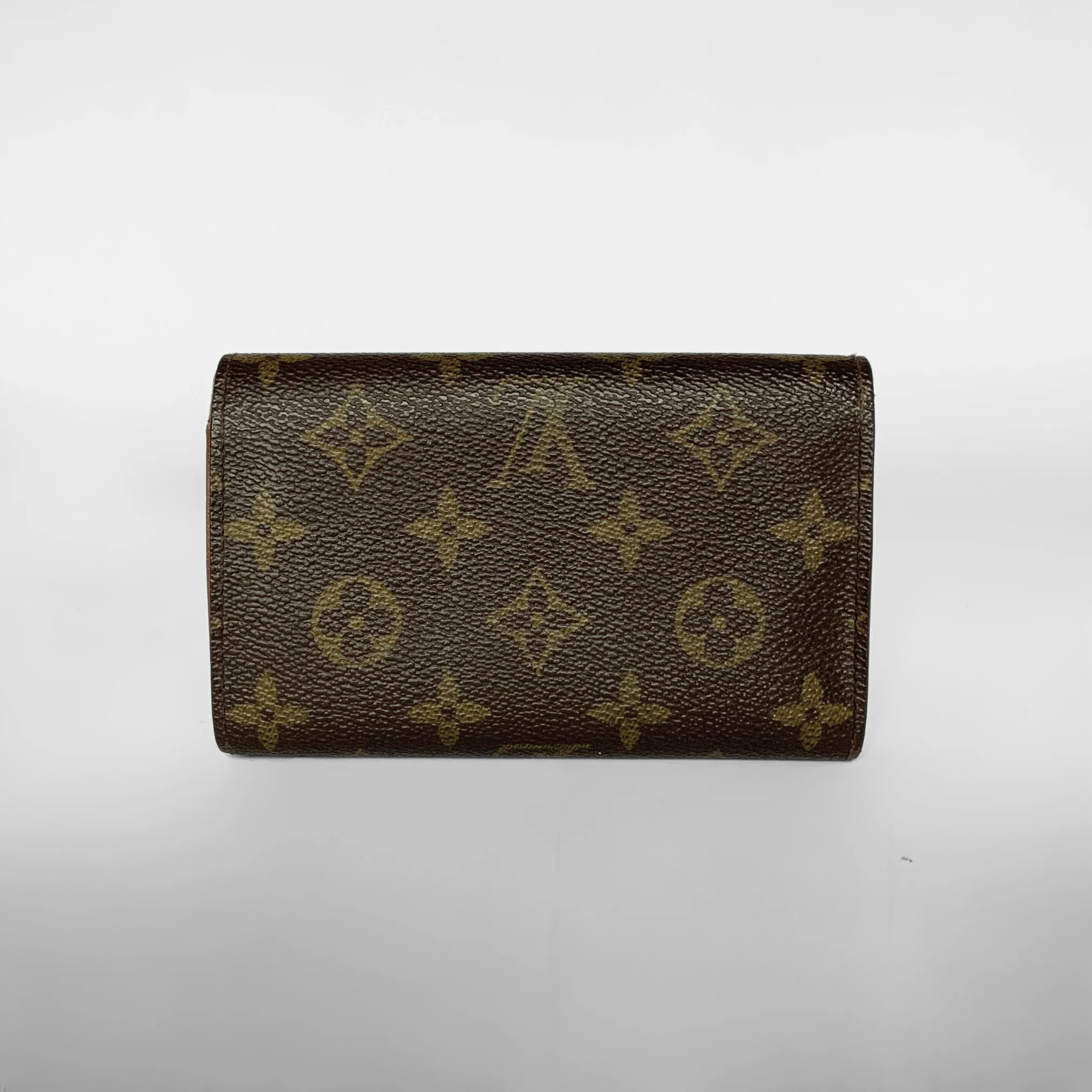 Louis Vuitton wallet with monogram pattern on a white background