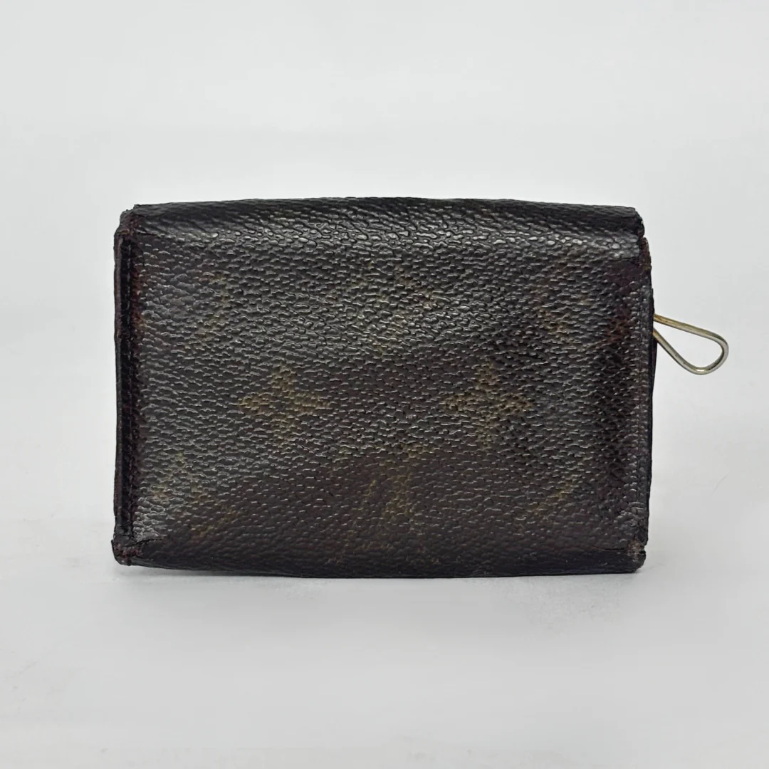 Black leather wallet on a light gray background