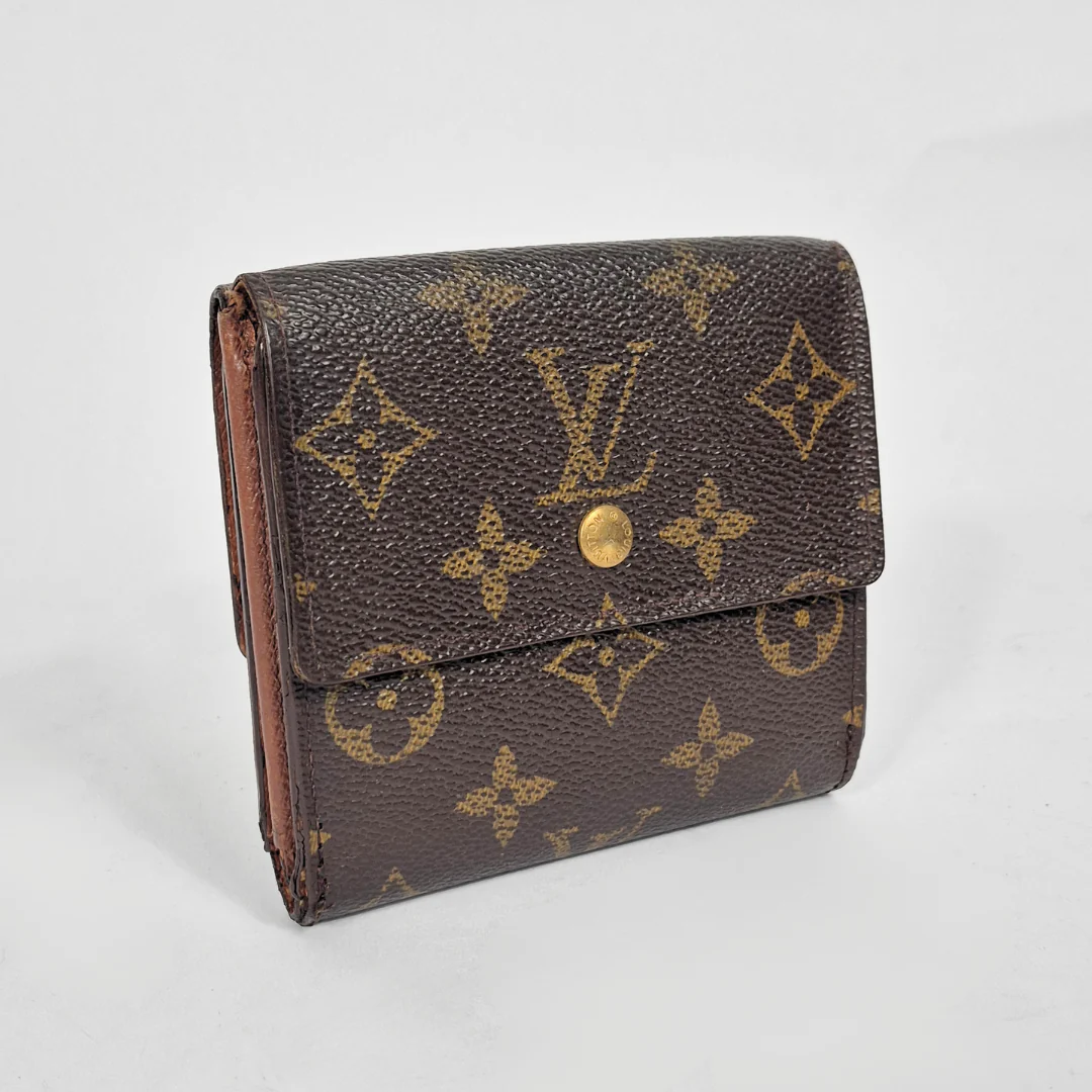Brown wallet with gold monogram pattern on a white background