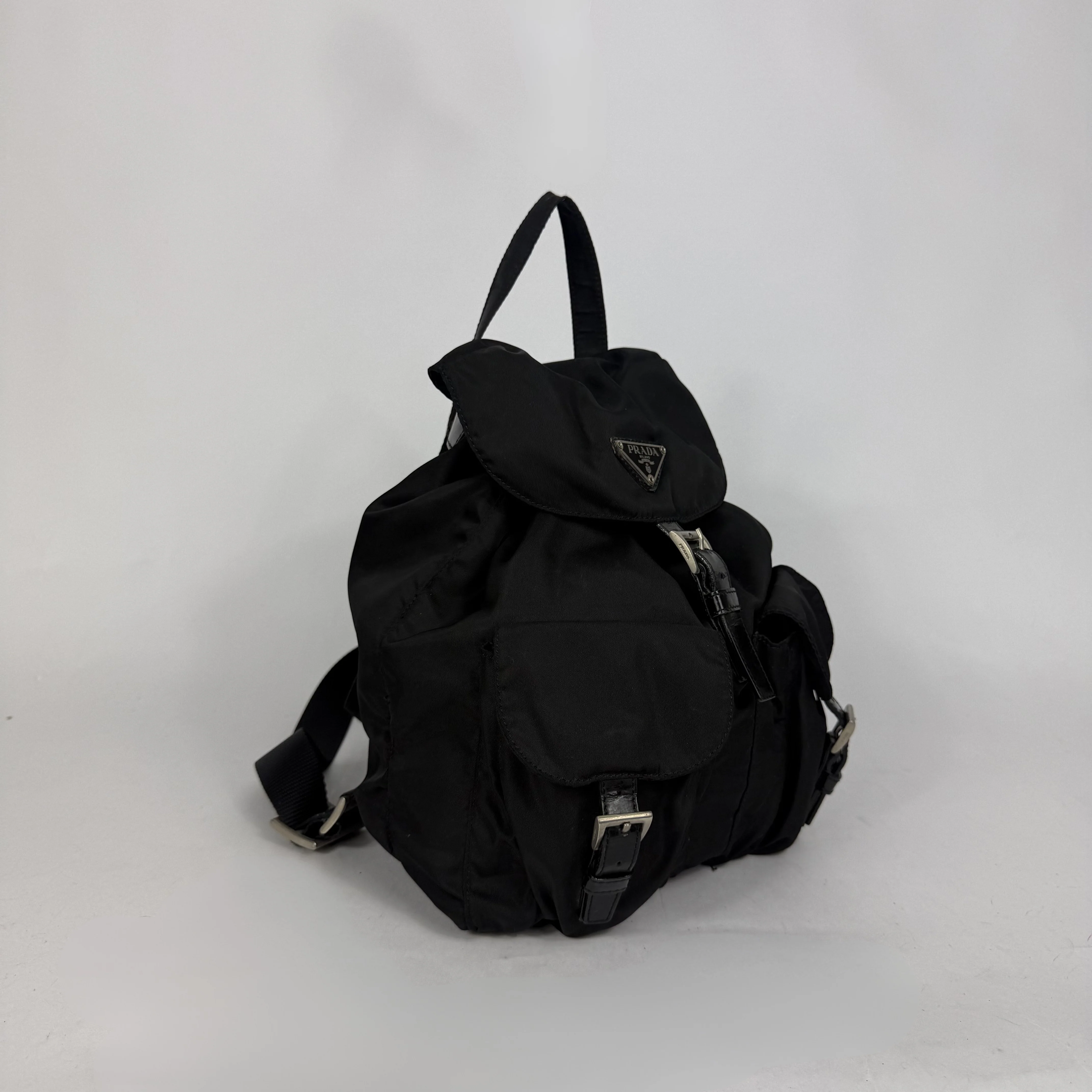 Black backpack with a brand logo on a white background