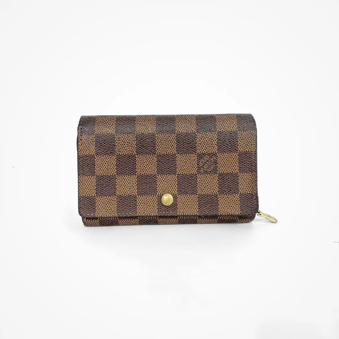 Brown checkered LV wallet with gold accents on a white background