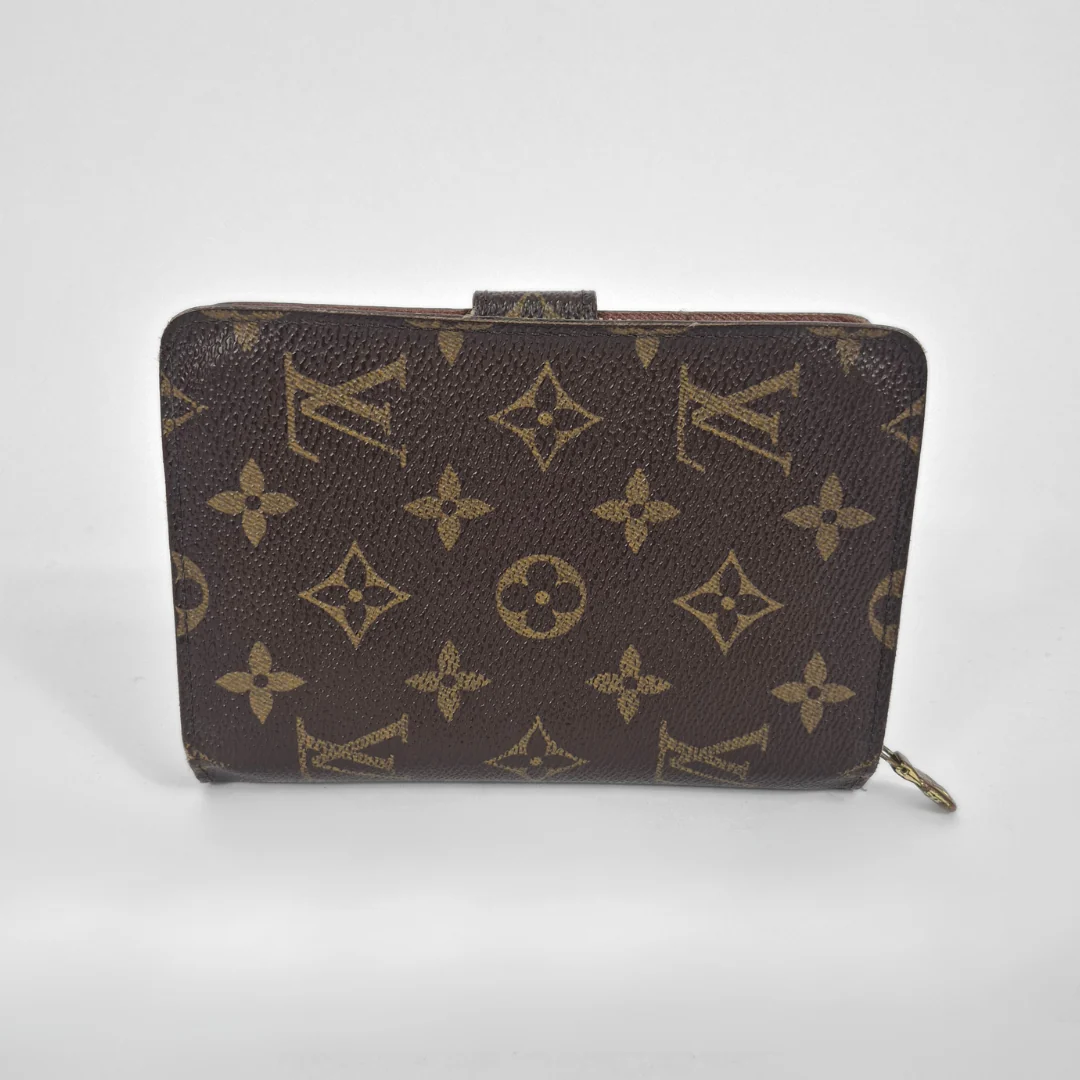 Brown wallet with gold monogram pattern on a white background