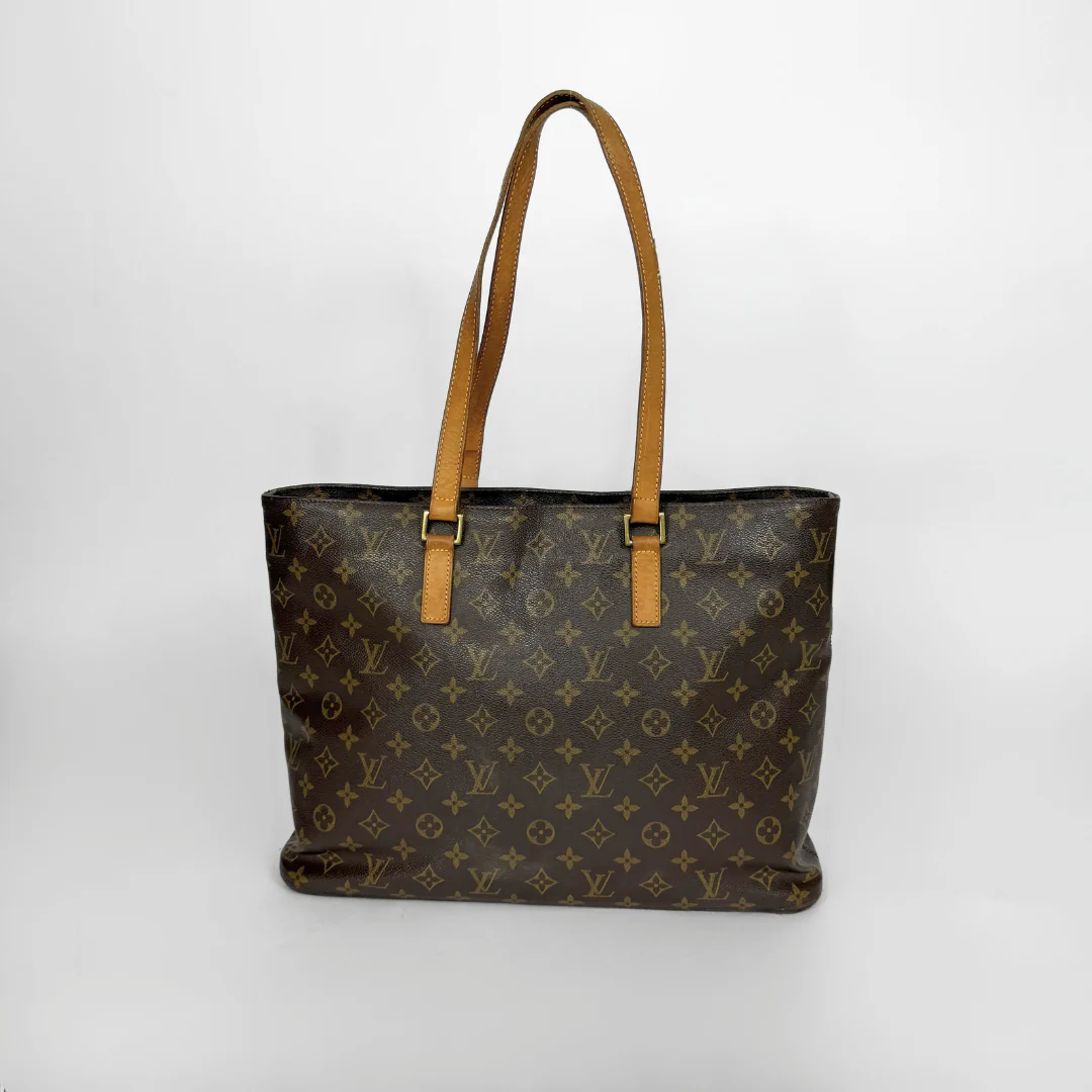Designer handbag with monogram pattern on a white background