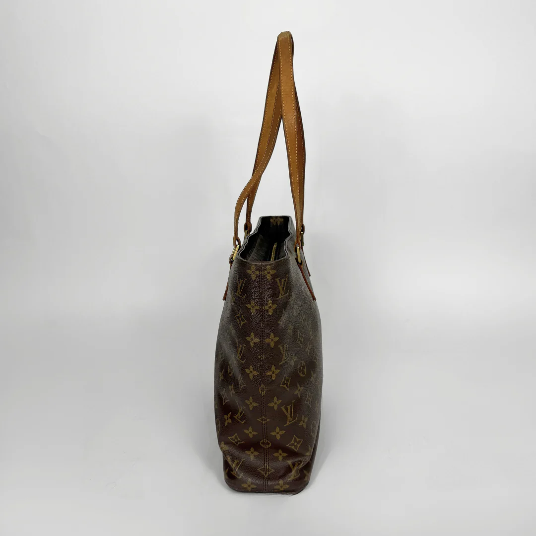 Brown handbag with visible brand logo on a white background