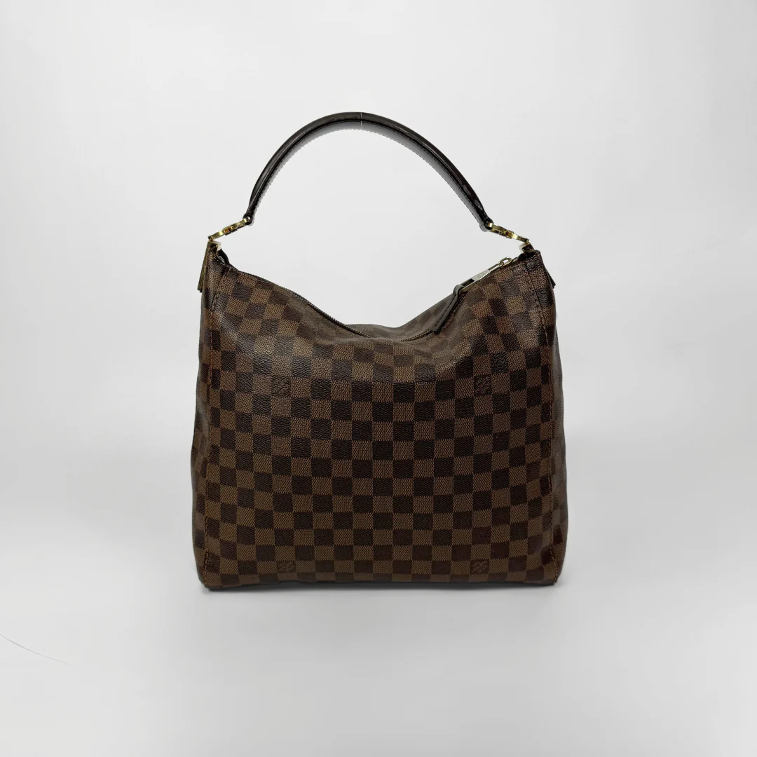 Brown checkered handbag with gold clasp on a white background