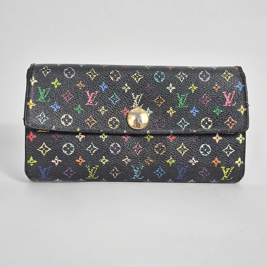 Black wallet with multicolor logo pattern on a gray background