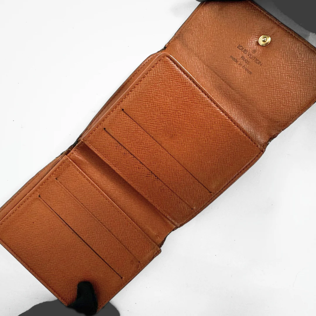 Brown leather wallet with visible brand name on a white background