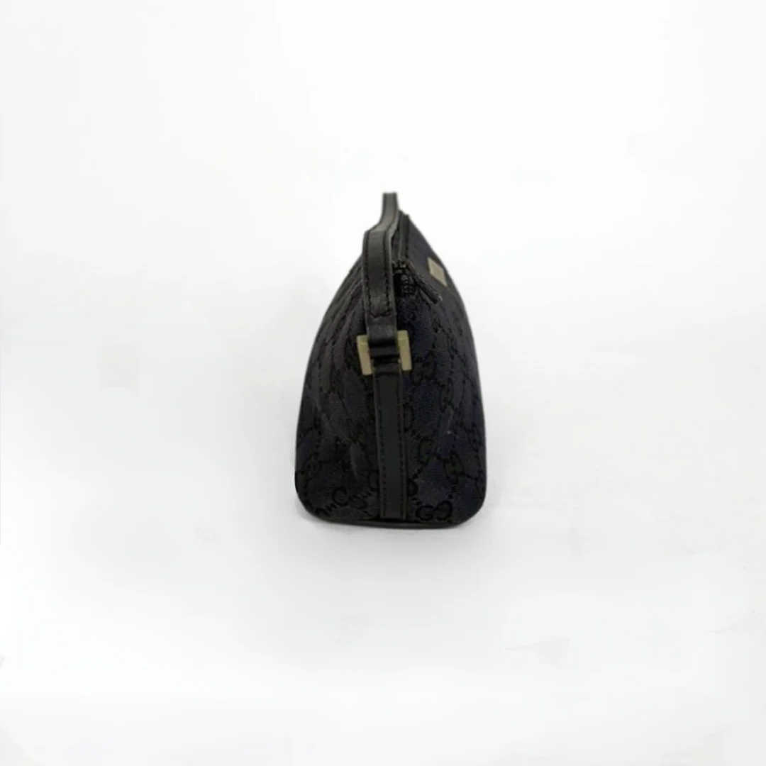 Gucci Boat Pochette in Canvas with the classic Gucci print on a white background