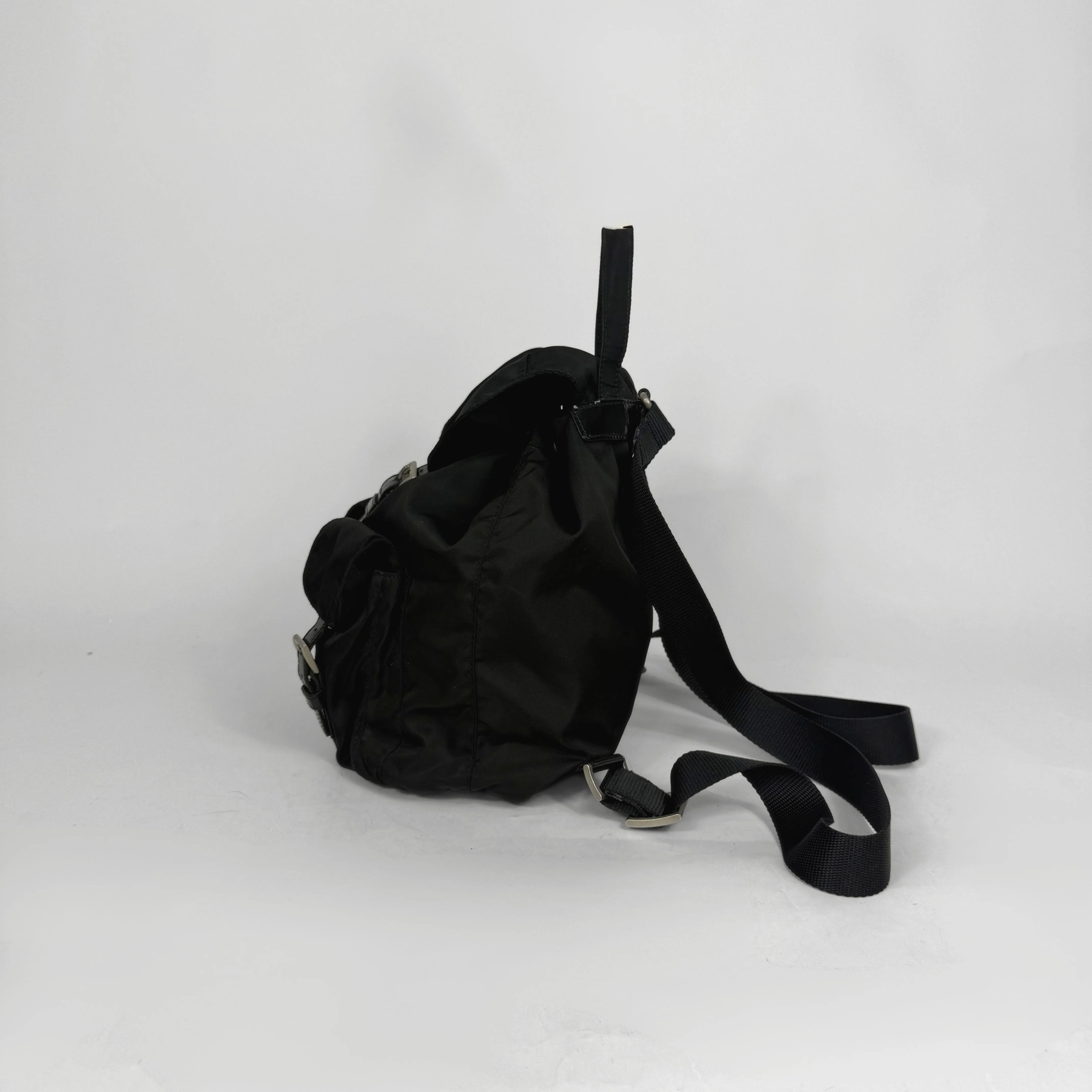 Black backpack on a white background