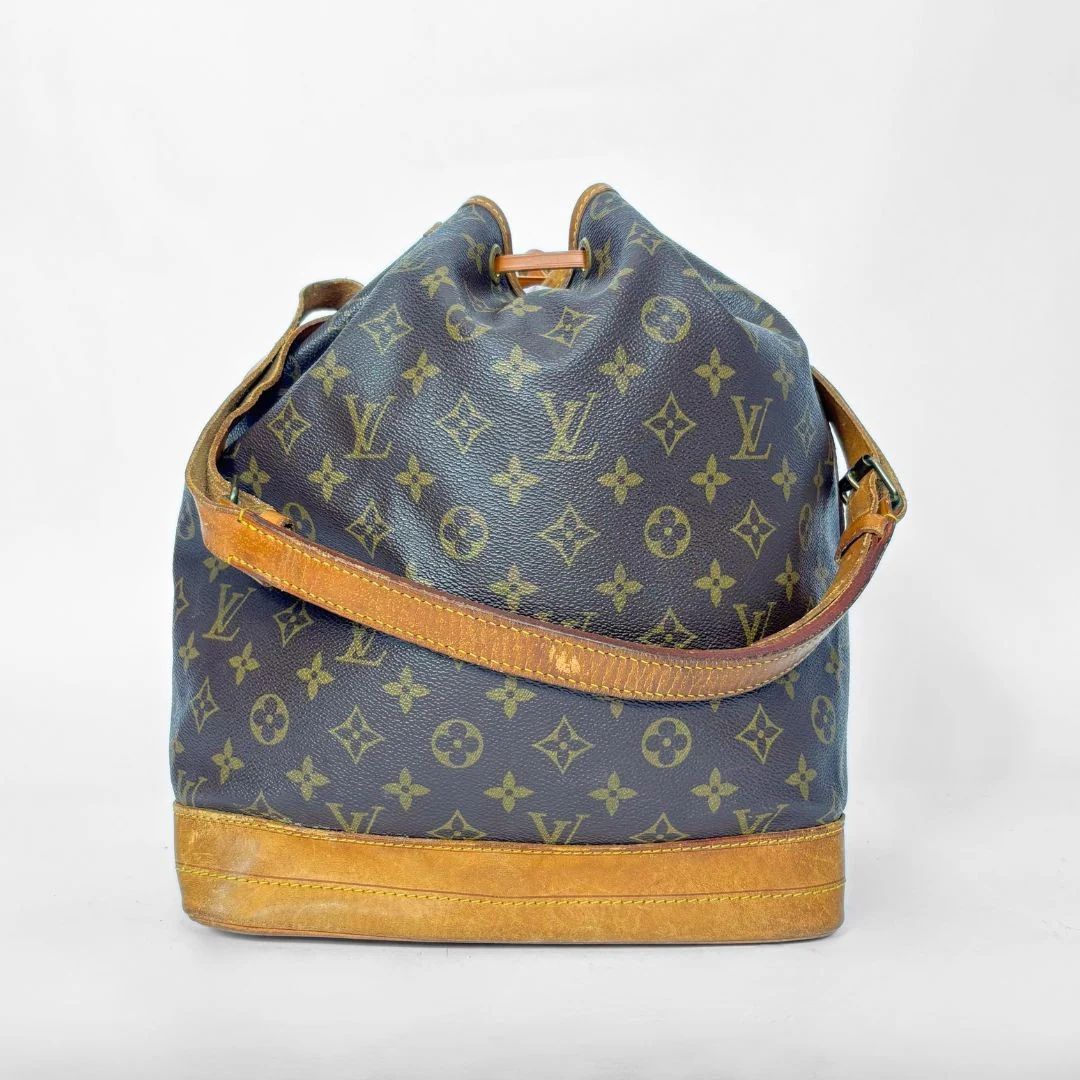 Brown monogram LV handbag with tan leather accents on a white background
