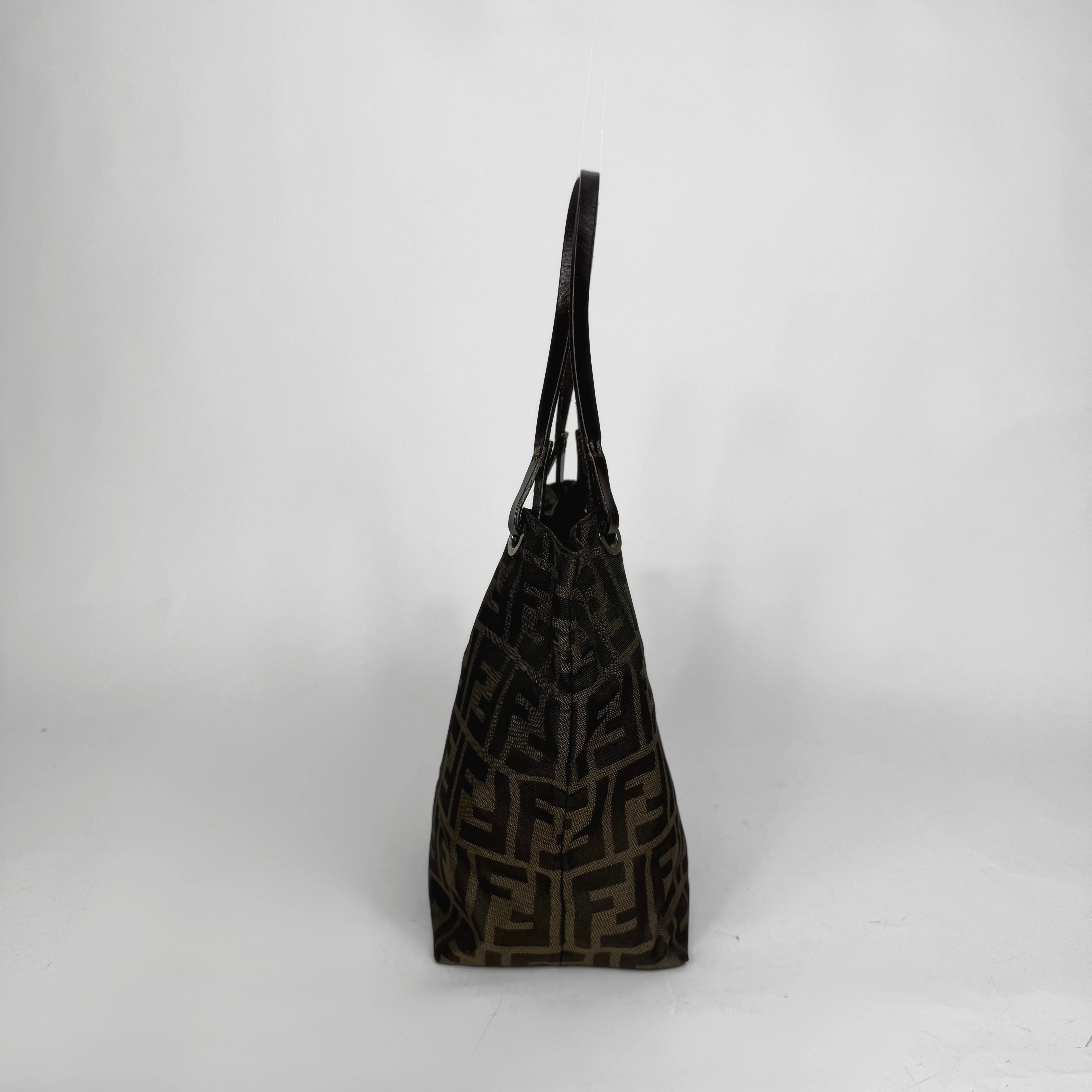 Black patterned handbag on a white background