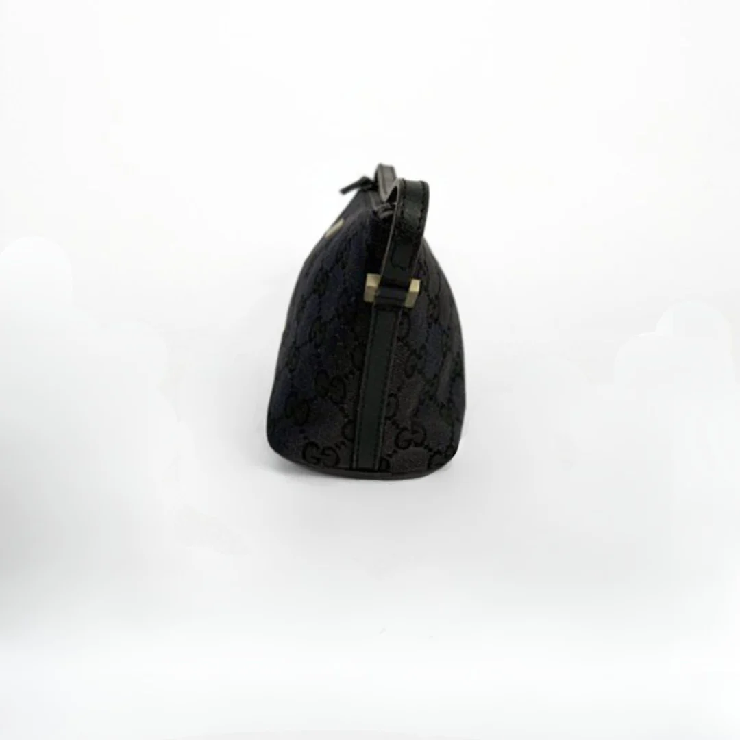 Gucci Boat Pochette in Canvas with the classic Gucci print on a white background