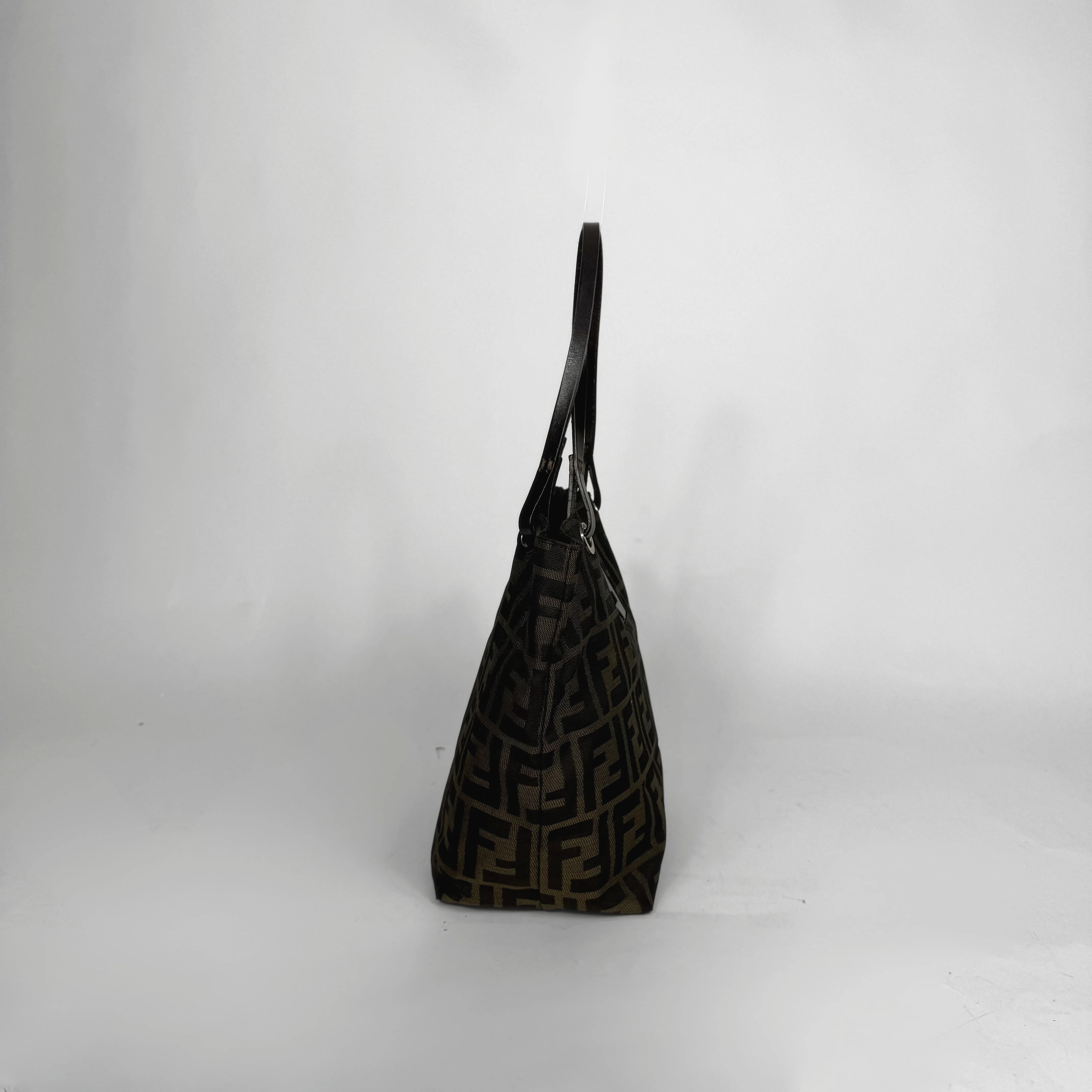 Black textured handbag on a white background