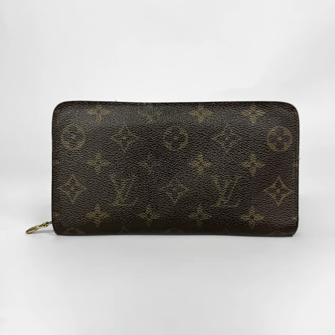 Designer wallet with monogram pattern on a white background