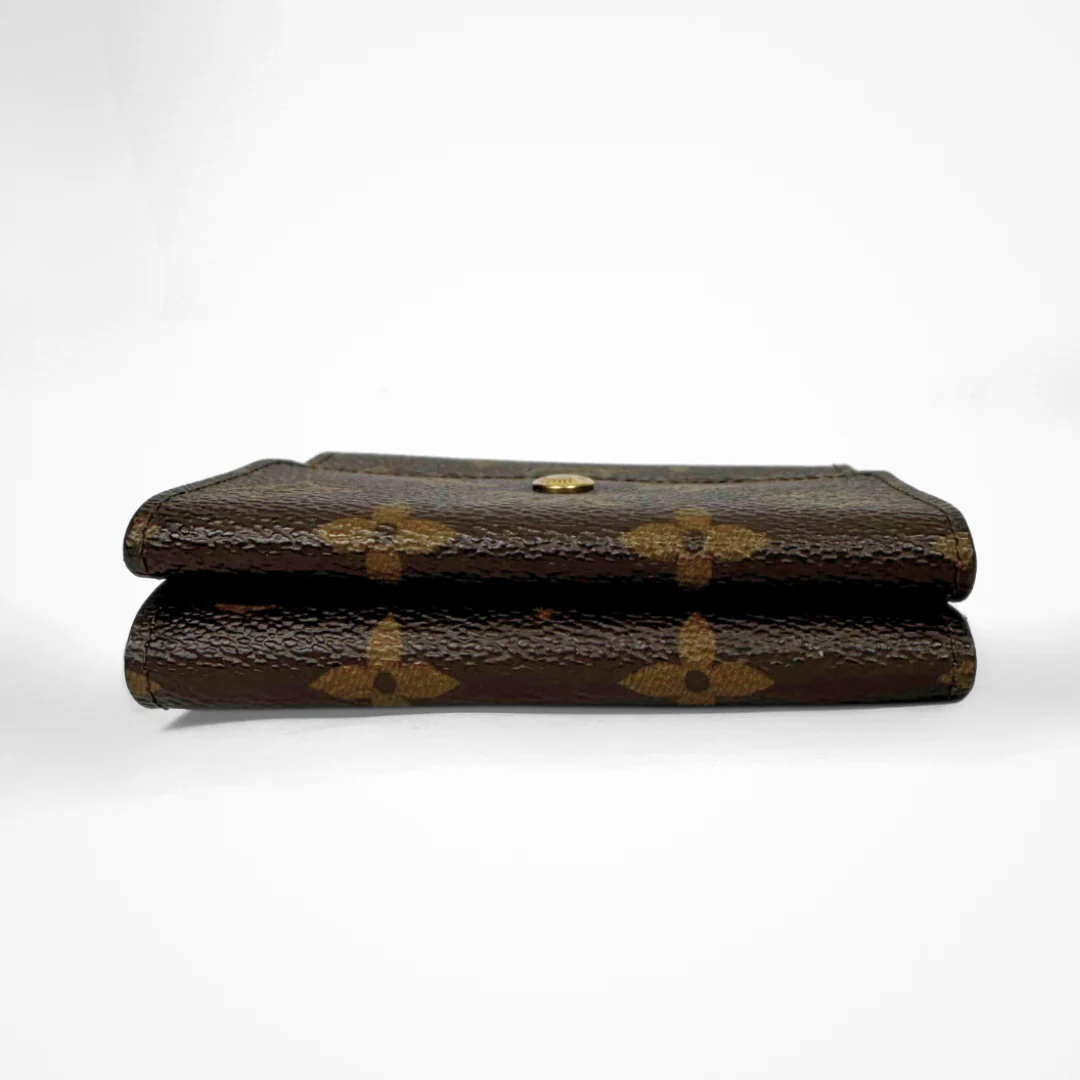 Louis Vuitton Druk Wallet on a white background