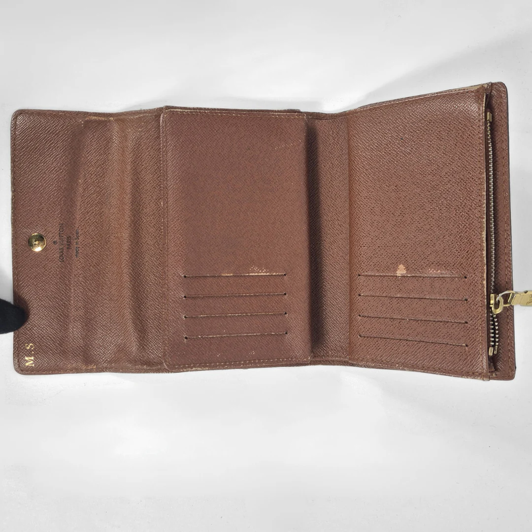 Brown leather wallet open on a white background