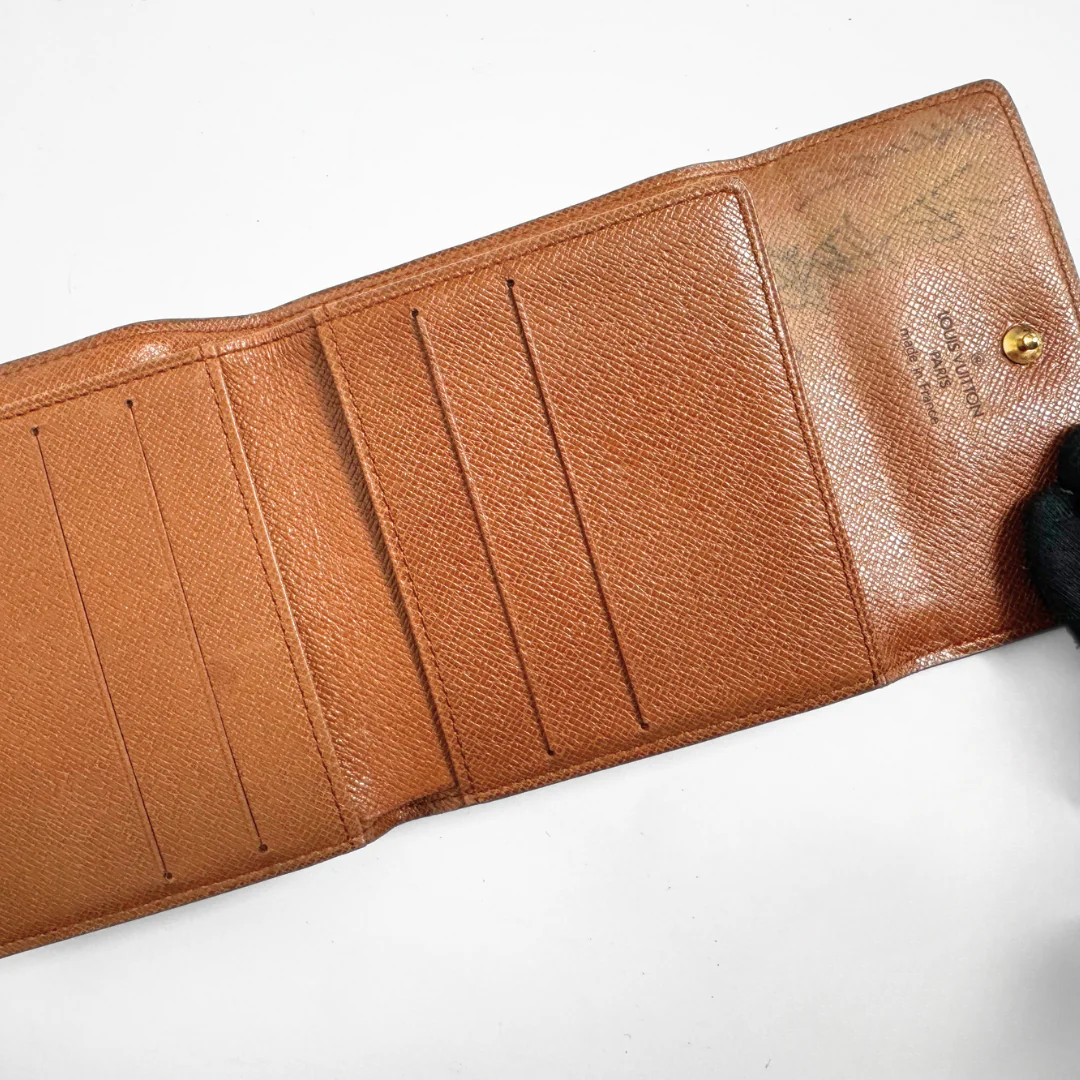 Louis Vuitton Druk Wallet on a white background