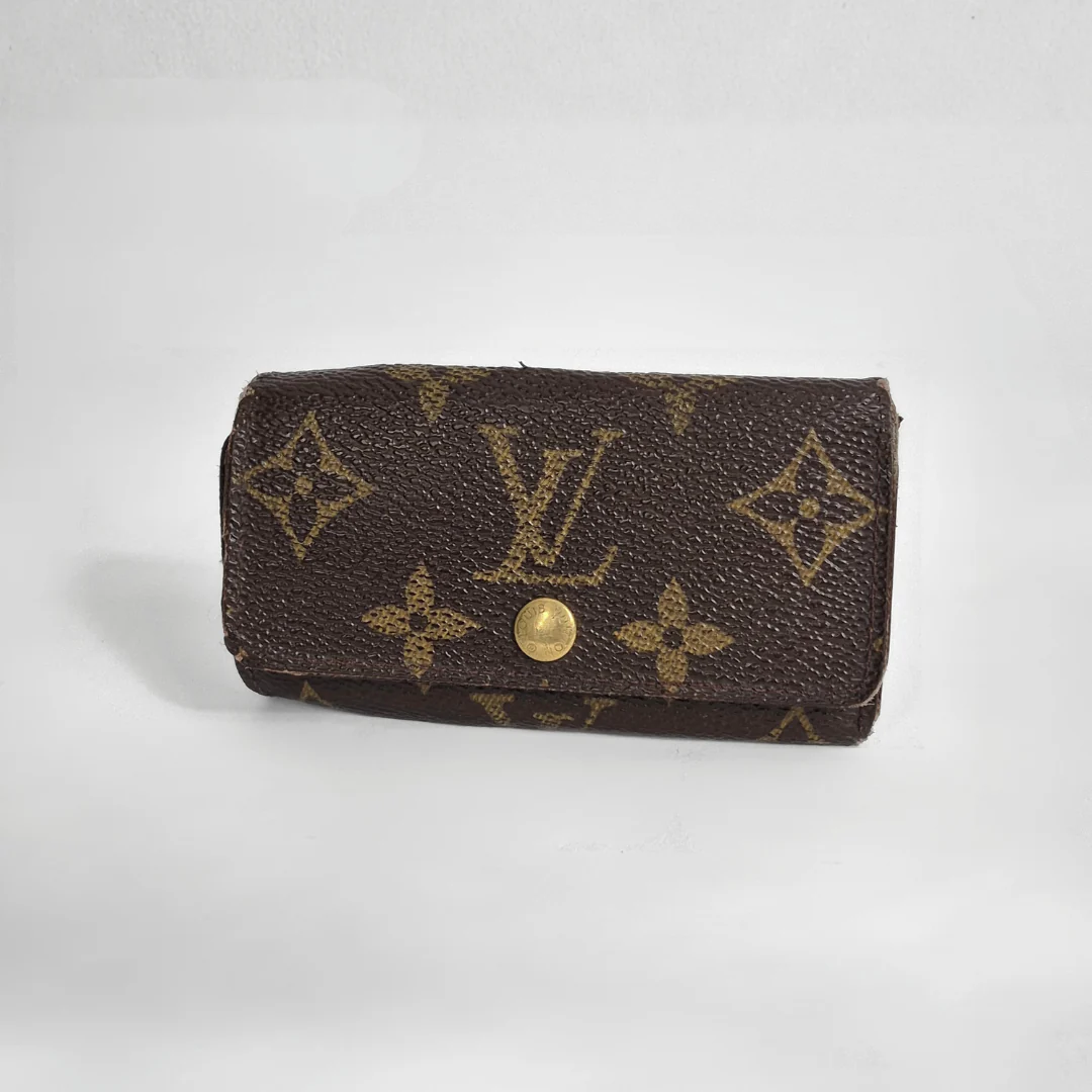 Louis Vuitton wallet with monogram pattern on white background