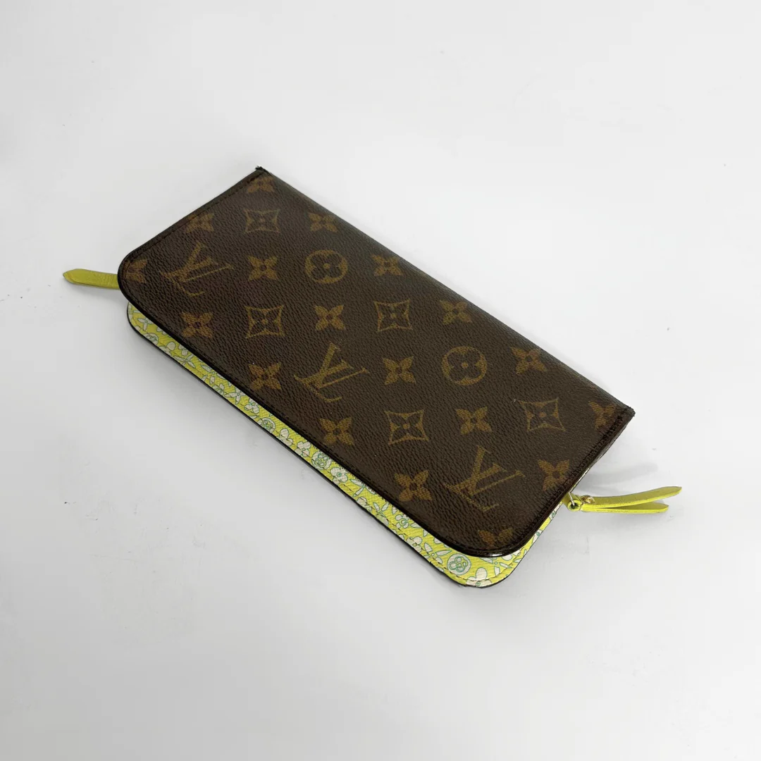 Designer wallet with monogram pattern on a white background