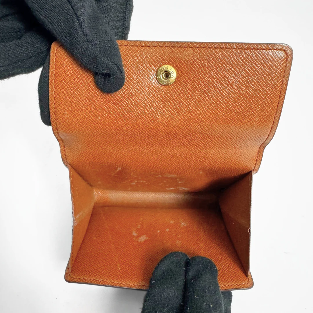Louis Vuitton Druk Wallet on a white background