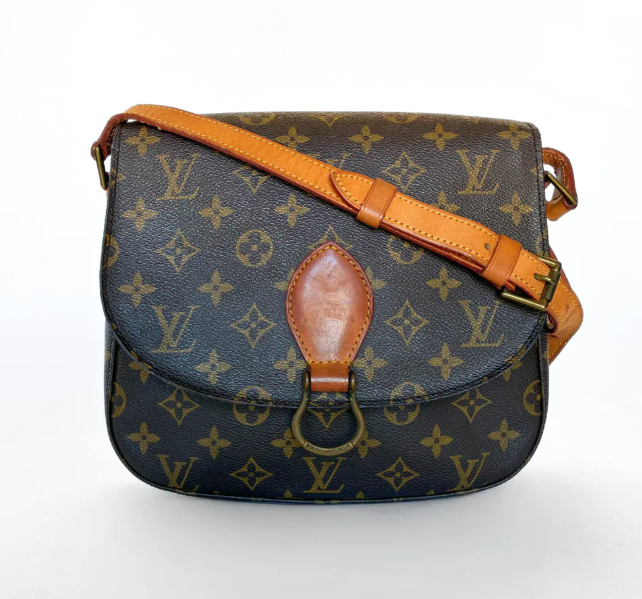 Designer handbag with monogram pattern on a white background