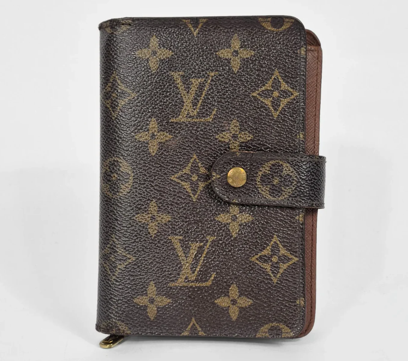 Brown wallet with monogram pattern on a white background
